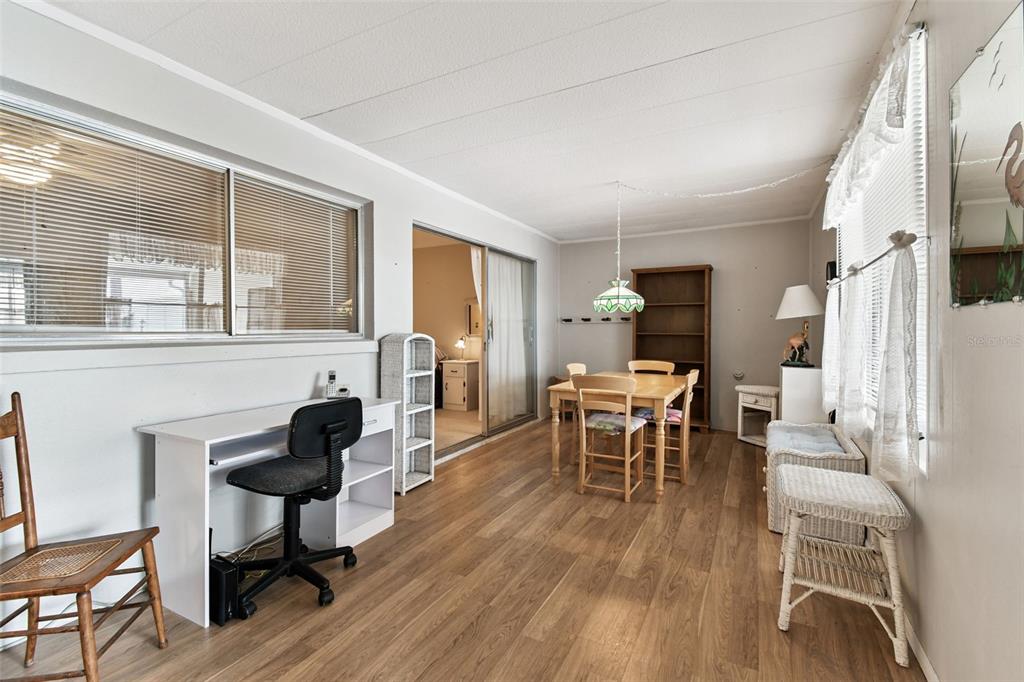 250 Rosery Road Northwest, Unit 333 Largo, FL 33770 - Photo 14 of 63 a living room with furniture a fireplace and a table