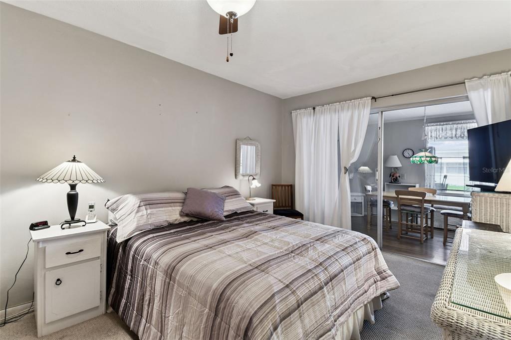 250 Rosery Road Northwest, Unit 333 Largo, FL 33770 - Photo 36 of 63 a bedroom with a bed and a table