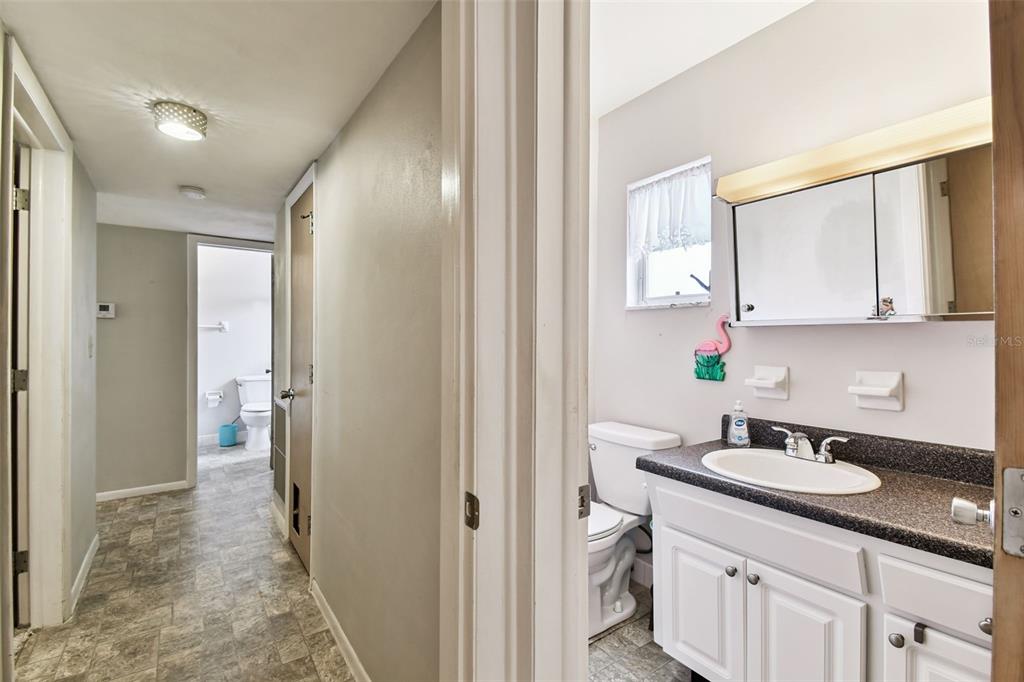 250 Rosery Road Northwest, Unit 333 Largo, FL 33770 - Photo 41 of 63 a bathroom with a sink and a mirror