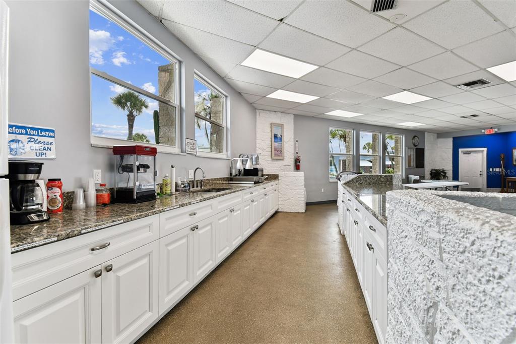 250 Rosery Road Northwest, Unit 333 Largo, FL 33770 - Photo 54 of 63 a large kitchen with stainless steel appliances granite countertop lots of counter top space