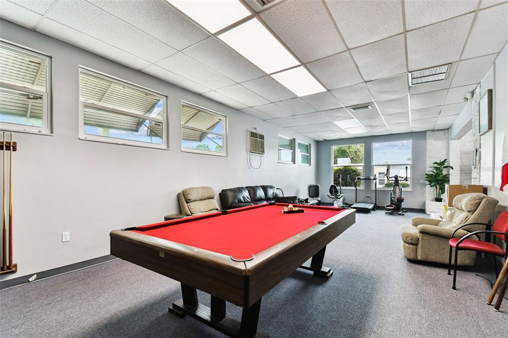 250 Rosery Road Northwest, Unit 333 Largo, FL 33770 - Photo 57 of 63 a room with pool table and windows