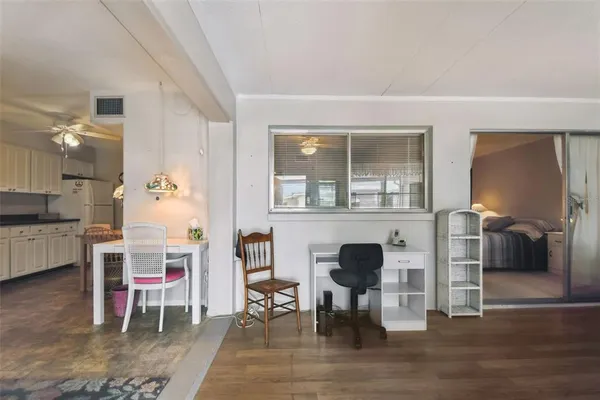 a view of a dining room with furniture window and wooden floor