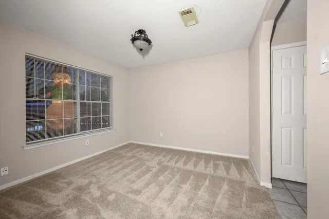 a view of empty room with windows