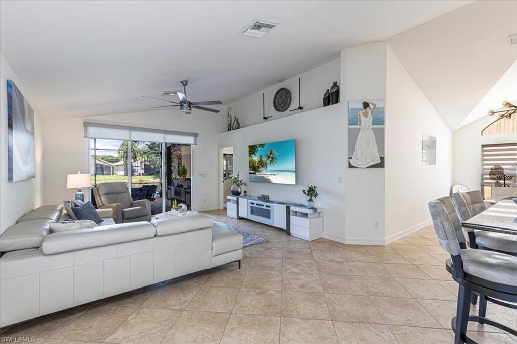 1630 Triangle Palm Terrace Naples, FL 34119 - Photo 9 of 24 a living room with furniture and a table