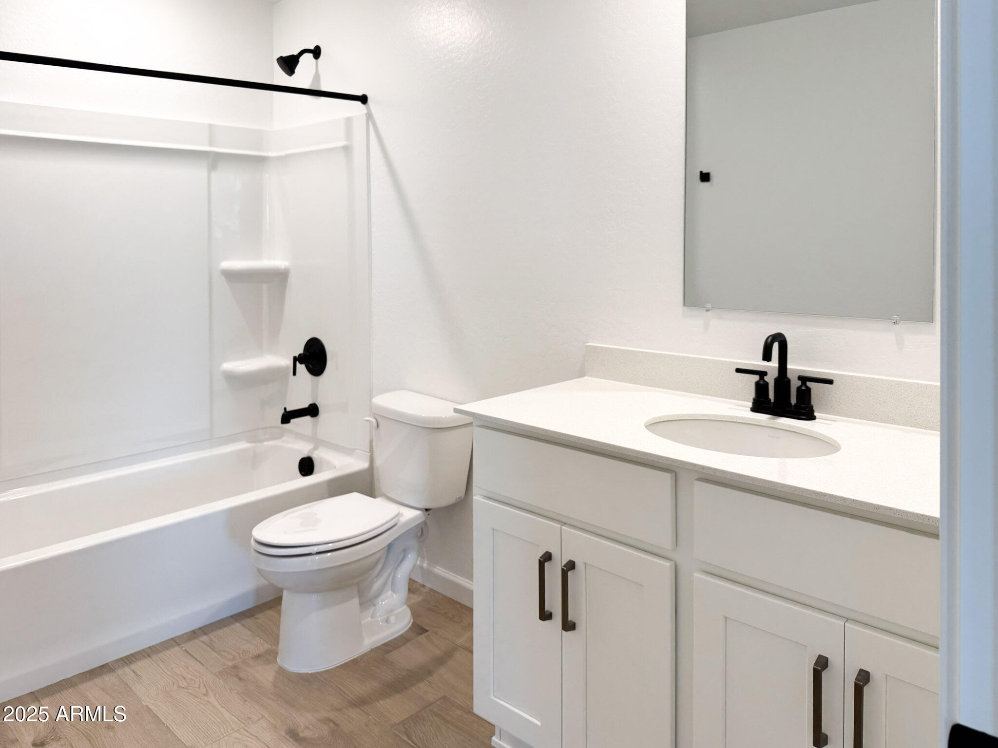 18203 La Senda Drive West Surprise, AZ 85387 - Photo 12 of 43 a bathroom with a sink toilet a mirror and shower