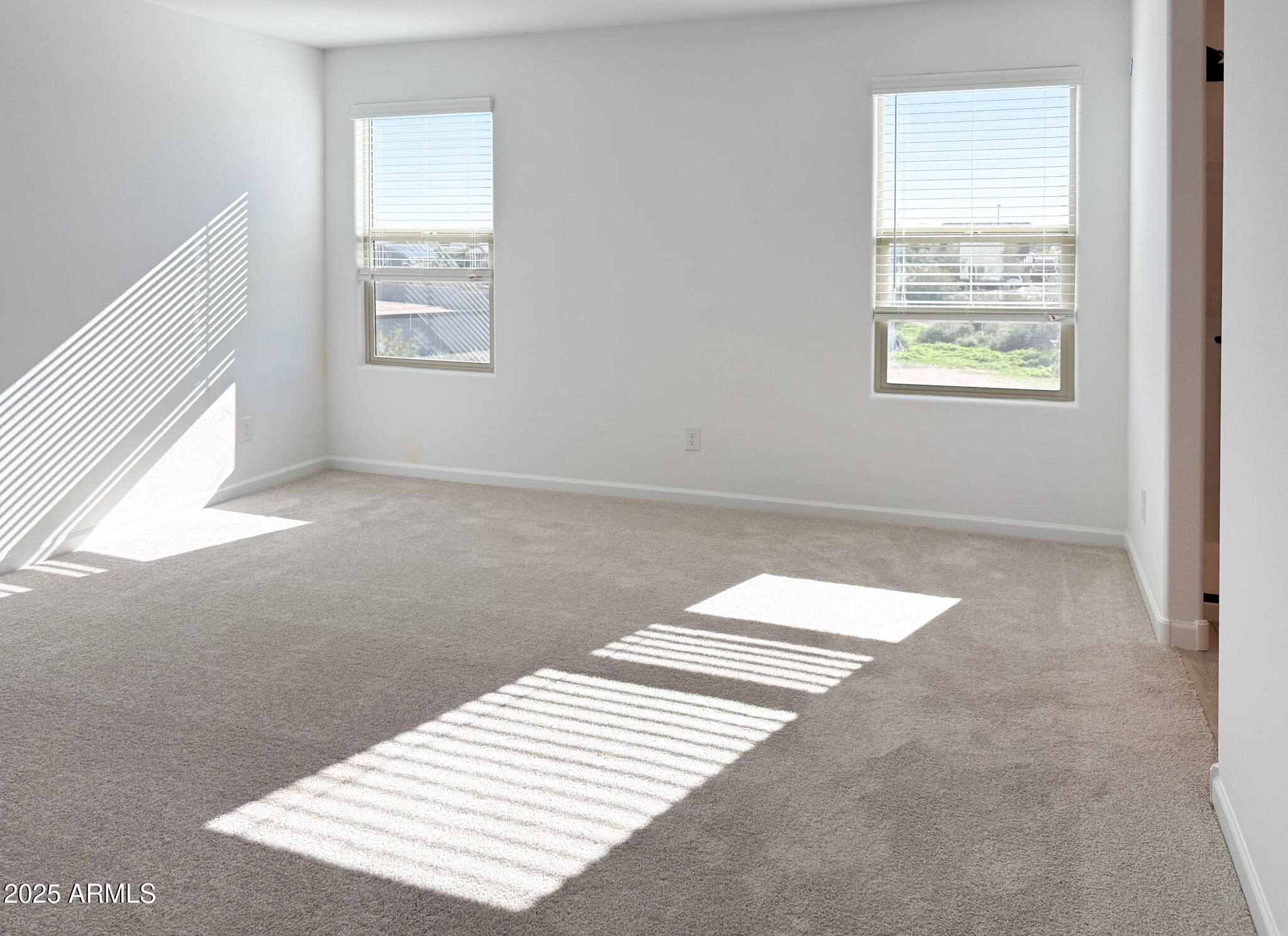 18203 La Senda Drive West Surprise, AZ 85387 - Photo 13 of 43 a view of wooden floor and windows in a room