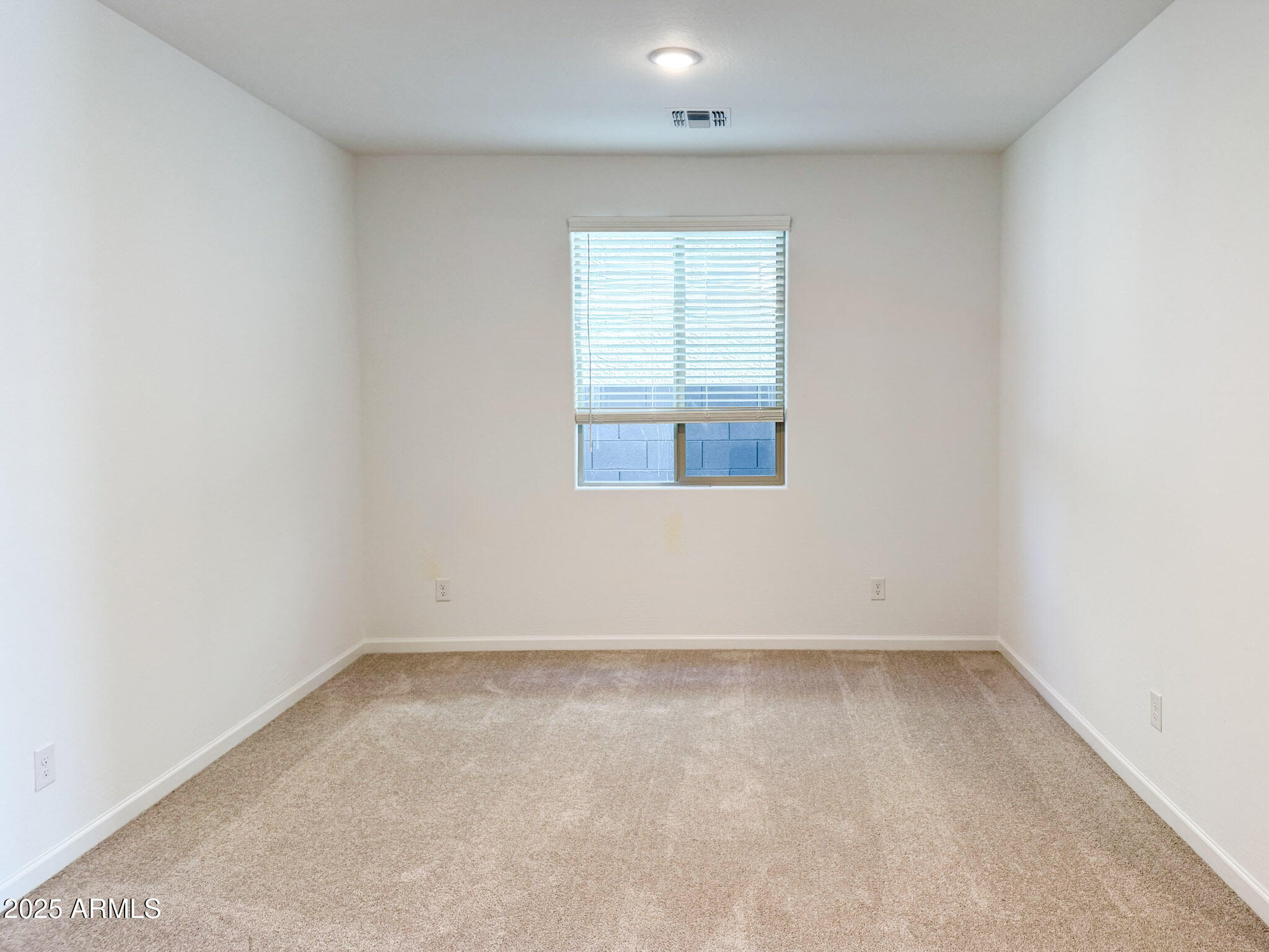 18203 La Senda Drive West Surprise, AZ 85387 - Photo 9 of 43 an empty room with a window
