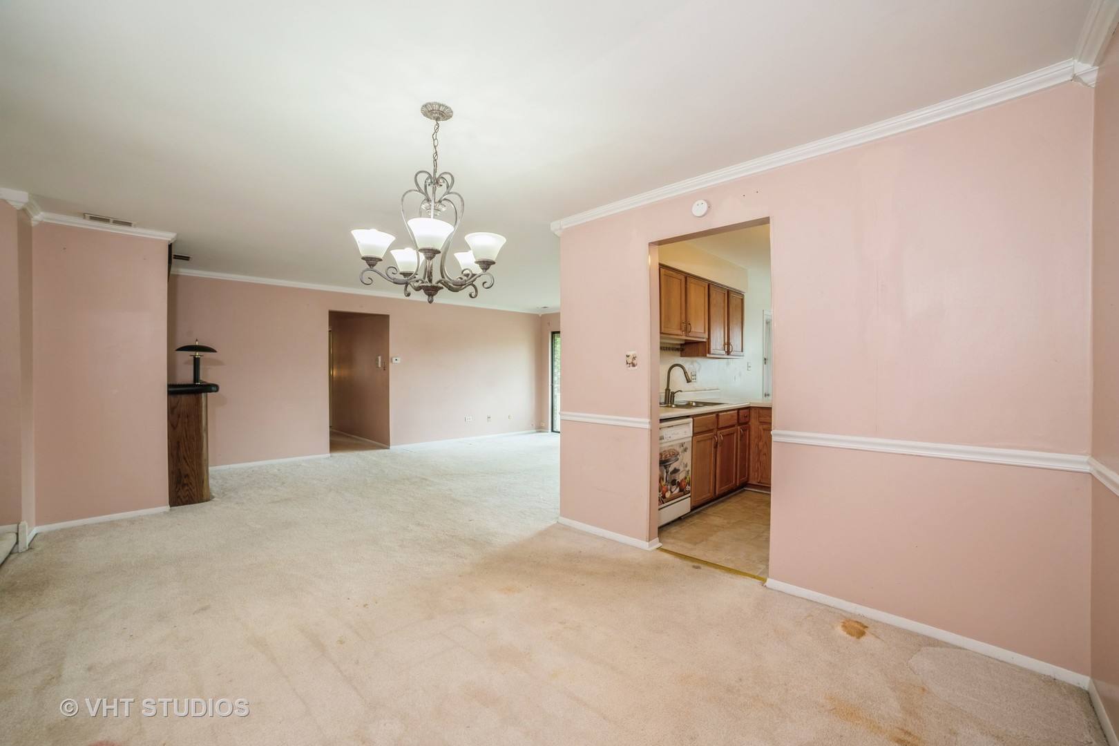 3241 West 184th Street, Unit 2B Homewood, IL 60430 - Photo 4 of 11 a view of a kitchen with a sink and a chandelier