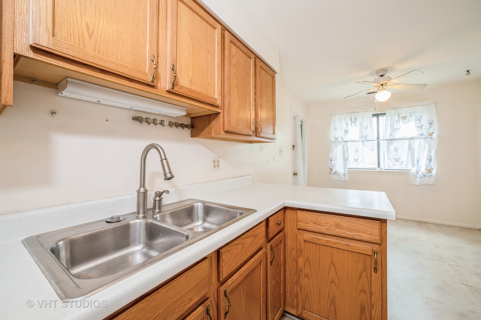 3241 West 184th Street, Unit 2B Homewood, IL 60430 - Photo 6 of 11 a kitchen with a sink cabinets and a window