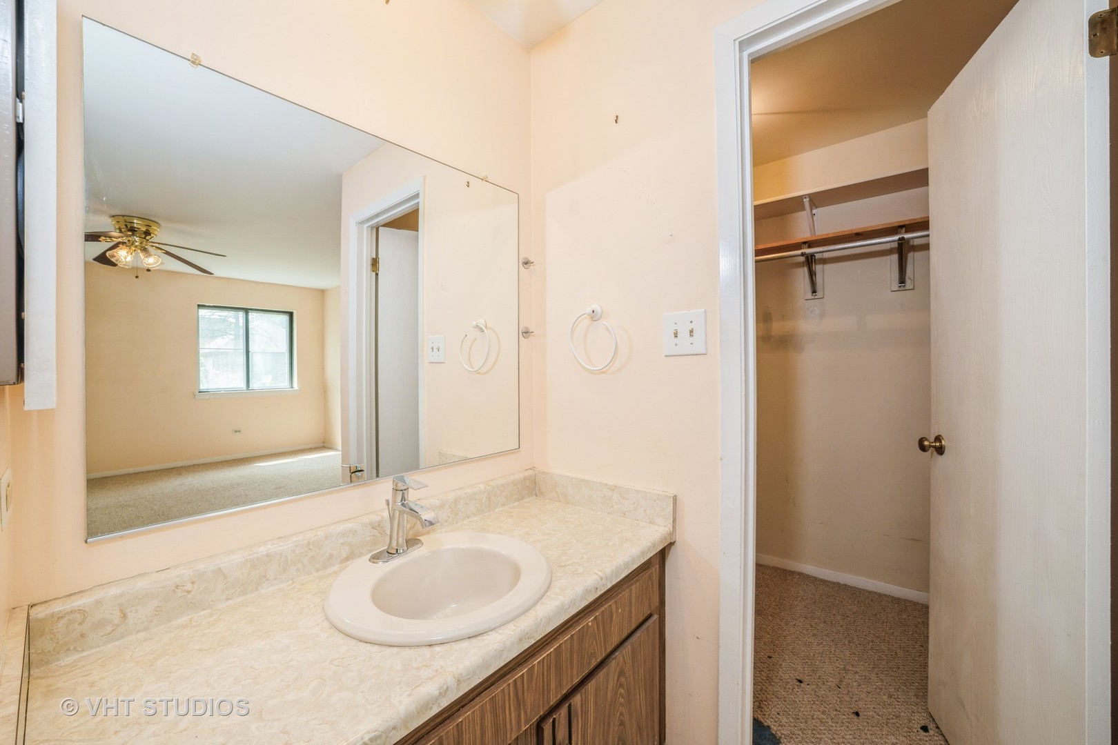 3241 West 184th Street, Unit 2B Homewood, IL 60430 - Photo 10 of 11 a bathroom with a granite countertop sink shower and a mirror