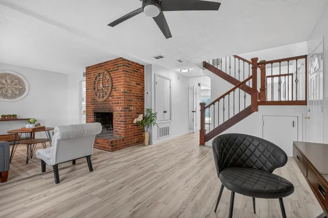 a view of entryway with wooden floor and stairs