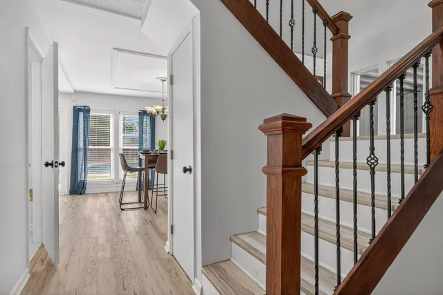 a view of a dining room with furniture window and wooden floor