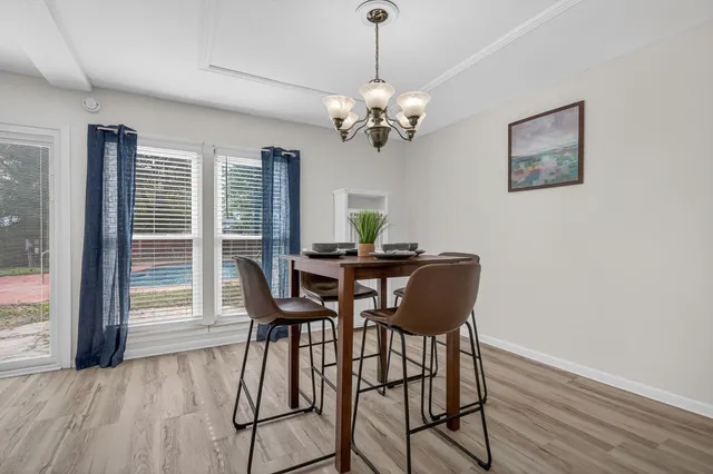 a view of a livingroom with furniture and wooden floor
