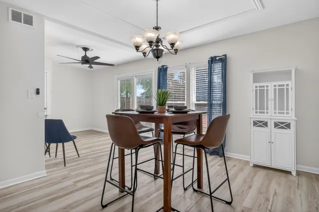 a view of a livingroom with furniture and wooden floor
