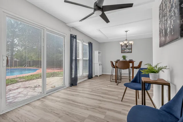 a kitchen with sink and refrigerator