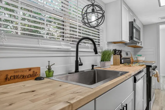 a bedroom with a bed and a table