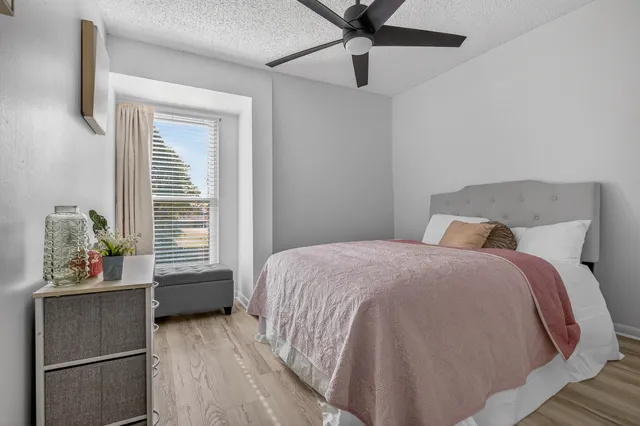 a bathroom with a granite countertop sink mirror and shower