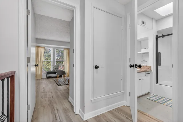 a bedroom with furniture and a window