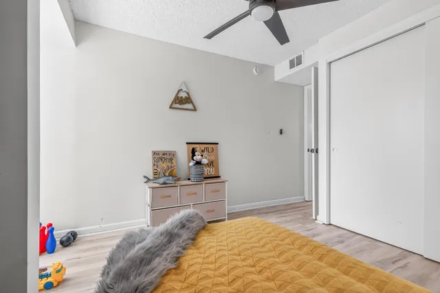 a view of a backyard with swimming pool