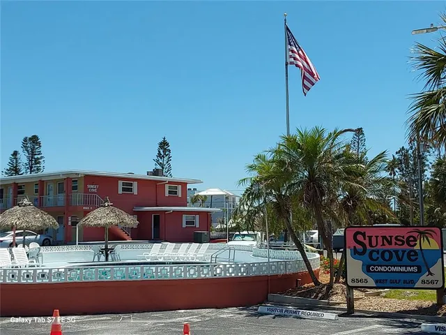 a front view of a building with garden