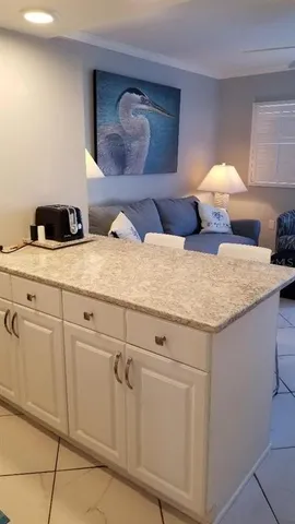 a view of kitchen with cabinets