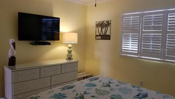 a room with a bed and a window