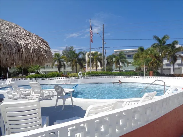 a view of a swimming pool with a patio