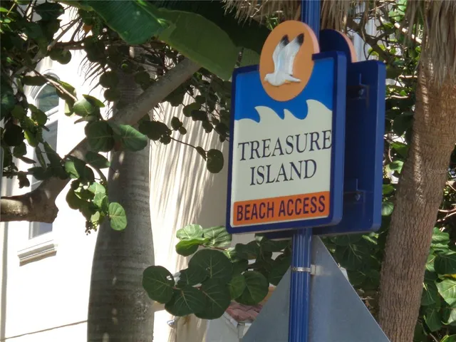 a sign that is on a brick wall