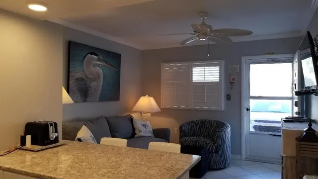 a bedroom with bed and a large window