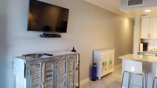 a view of a livingroom with furniture and a flat screen tv