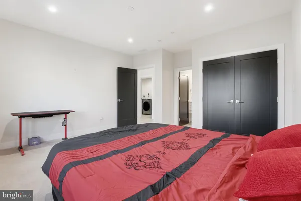 a bedroom with a bed and a lamp