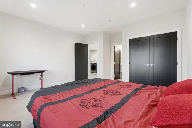 a bedroom with a bed and a lamp