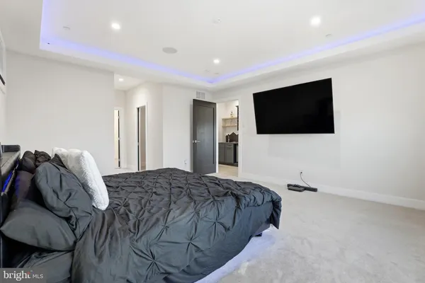 a bathroom with a sink a large mirror and a bathtub