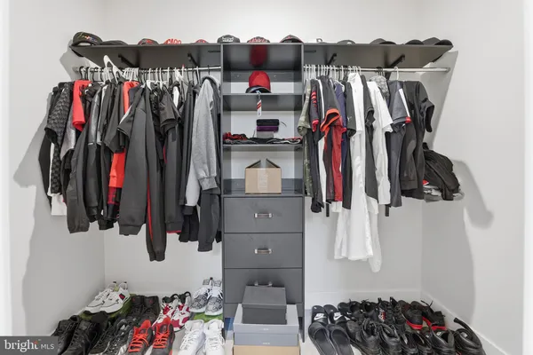 a bedroom with bed and a dresser