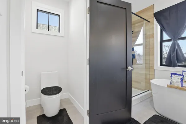 a house view with swimming pool in front of it