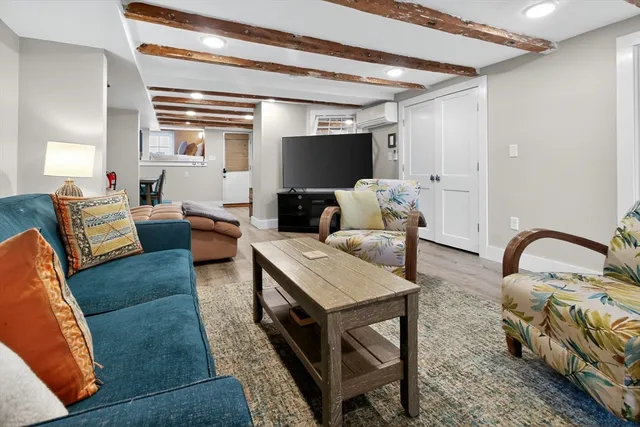 a bedroom with a bed and a mirror