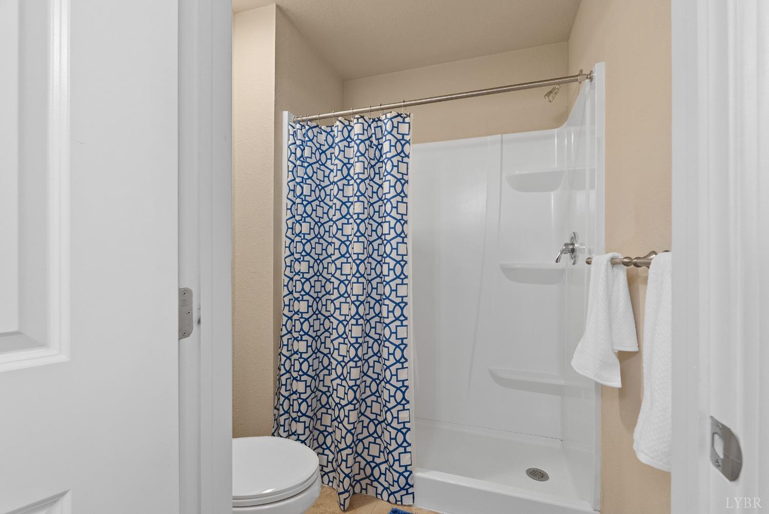 1600 Wards Ferry Road, Unit 907 Lynchburg, VA 24502 - Photo 23 of 53 a bathroom with a shower and a toilet