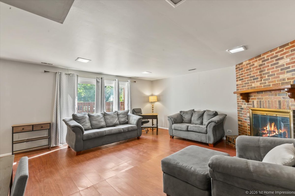 18847 May Avenue Homewood, IL 60430 - Photo 19 of 26 a living room with furniture and a fireplace