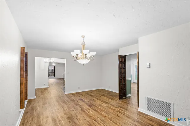 a view of a livingroom with wooden floor