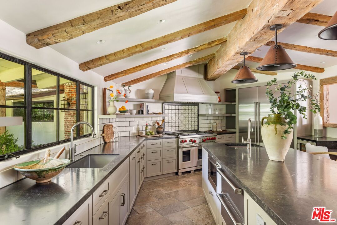 3099 Mandeville Canyon Road Los Angeles, CA 90049 - Photo 15 of 50 a kitchen with lots of counter top space