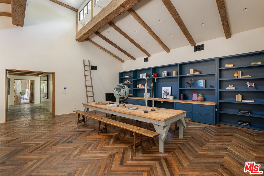 3099 Mandeville Canyon Road Los Angeles, CA 90049 - Photo 21 of 50 a view of a dining room with furniture