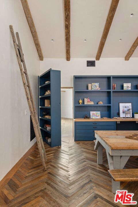 3099 Mandeville Canyon Road Los Angeles, CA 90049 - Photo 22 of 50 a room with furniture and wooden floor