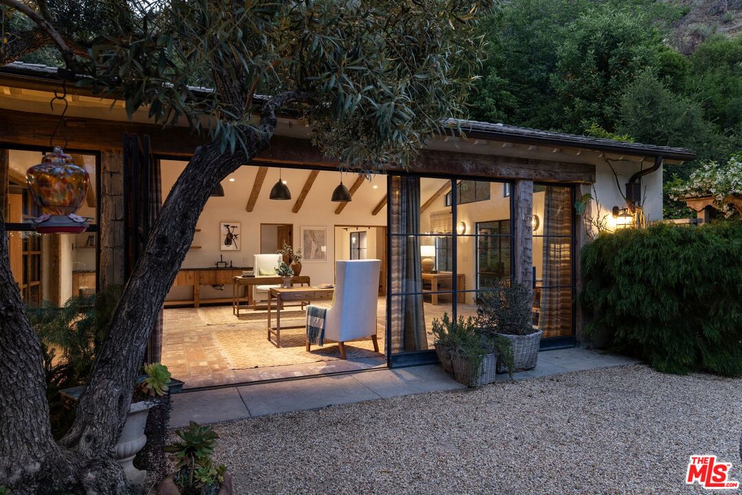 3099 Mandeville Canyon Road Los Angeles, CA 90049 - Photo 9 of 50 a view of swimming pool with a patio