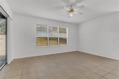 an empty room with windows and natural light