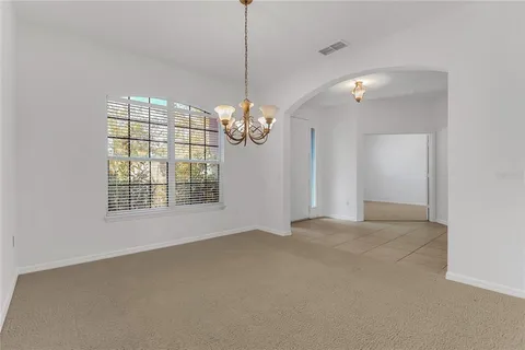 a view of a kitchen with a sink and microwave