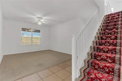a kitchen with stainless steel appliances granite countertop a refrigerator a stove a sink and a microwave