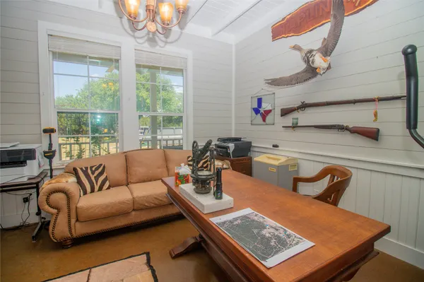 a living room with furniture fireplace and a flat screen tv