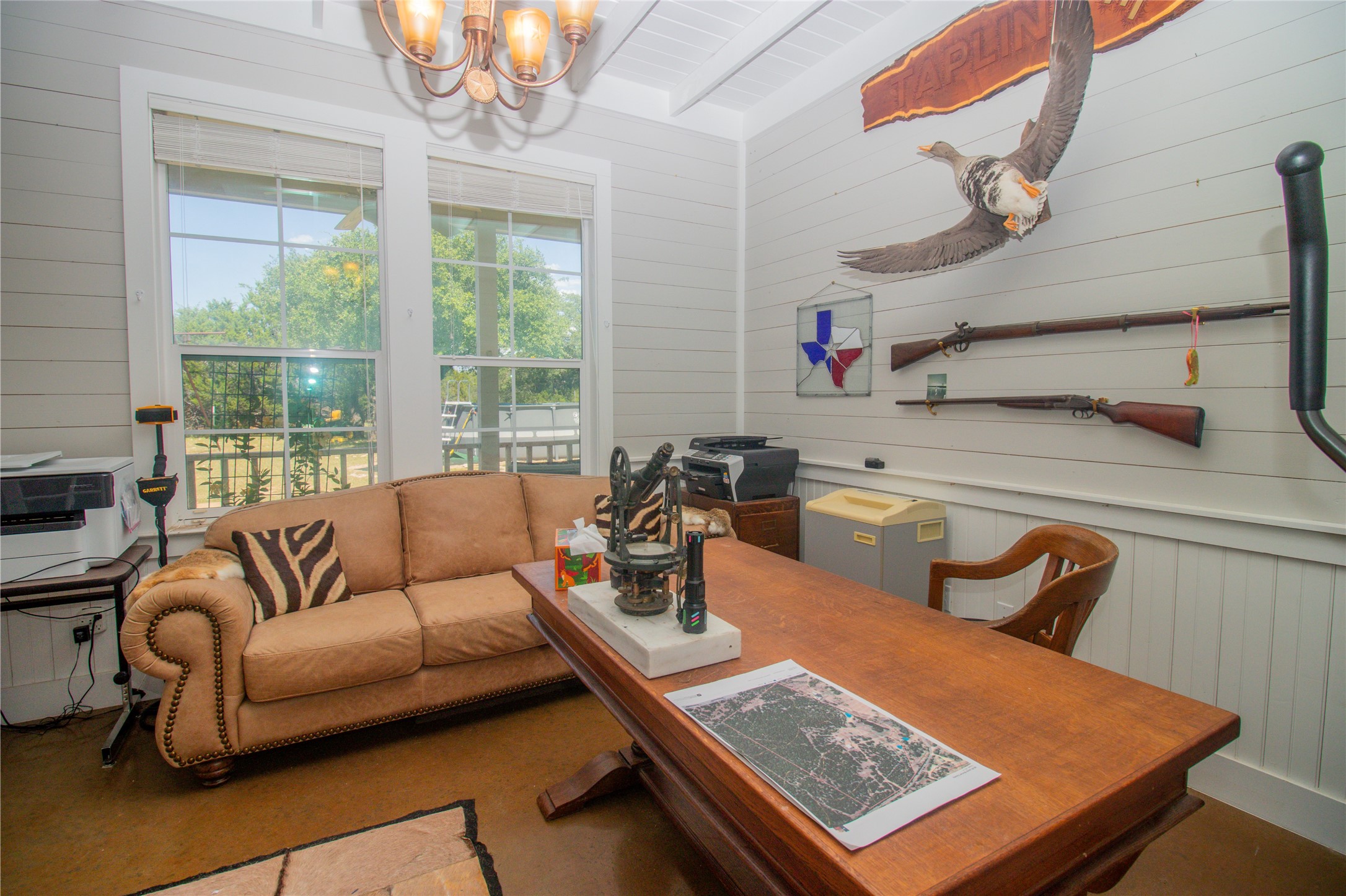 4237 County Road 330 Burnet, TX 78611 - Photo 13 of 40 a living room with furniture a flat screen tv and a large window