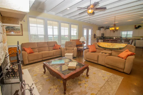 a view of a livingroom with furniture and windows