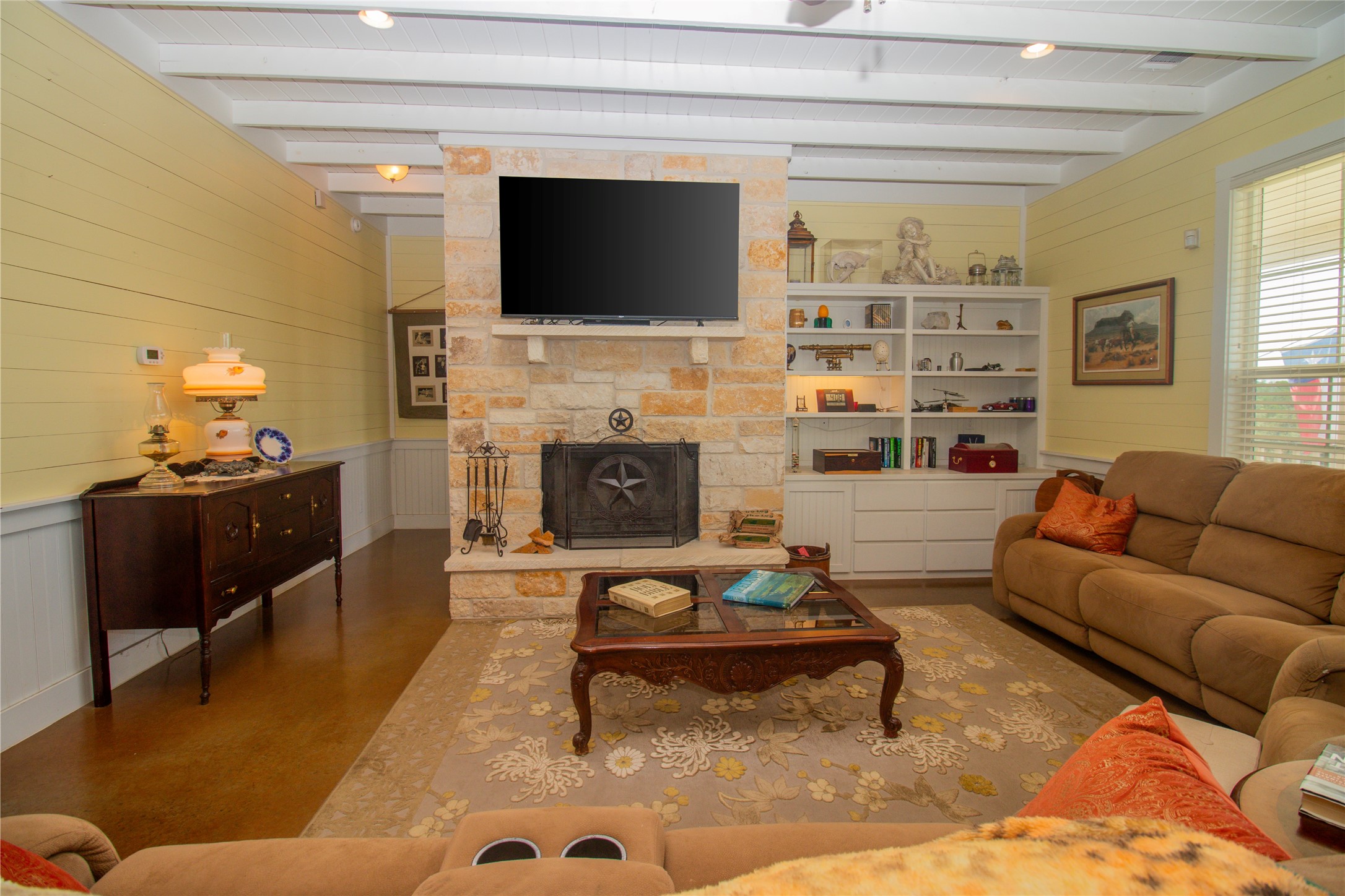 4237 County Road 330 Burnet, TX 78611 - Photo 15 of 40 a living room with furniture fireplace and a flat screen tv